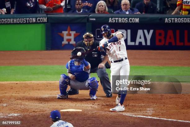 Carlos Correa of the Houston Astros hits a two-run home run during the seventh inning against the Los Angeles Dodgers in game five of the 2017 World...