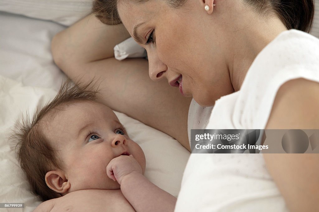 Mother and baby lying down