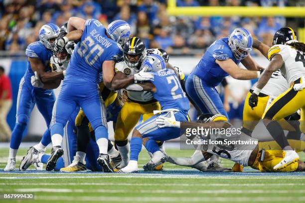Detroit Lions running back Ameer Abdullah is stopped by Pittsburgh Steelers linebacker Vince Williams during second half game action between the...