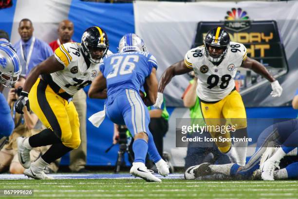Pittsburgh Steelers defensive tackle Javon Hargrave and Pittsburgh Steelers linebacker Vince Williams converge on Detroit Lions running back Dwayne...