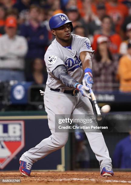 Yasiel Puig of the Los Angeles Dodgers hits a two-run home run during the ninth inning against the Houston Astros in game five of the 2017 World...