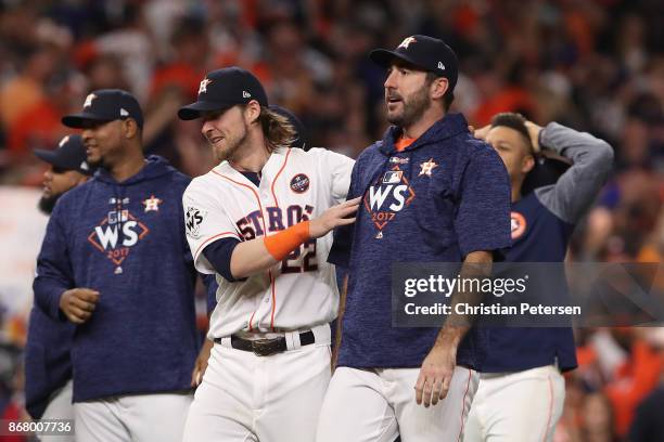 Justin Verlander of the Houston Astros celebrates with Josh Reddick after defeating the Los Angeles Dodgers during the tenth inning in game five of...