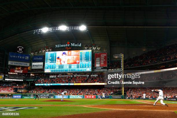 Alex Bregman of the Houston Astros hits a game-winning single during the tenth inning against the Los Angeles Dodgers in game five of the 2017 World...