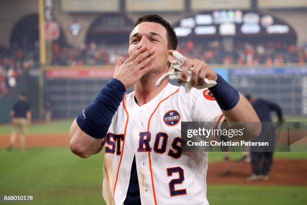 Alex Bregman of the Houston Astros celebrates after hitting the game-winning single during the tenth inning to defeat the Los Angeles Dodgers in game...