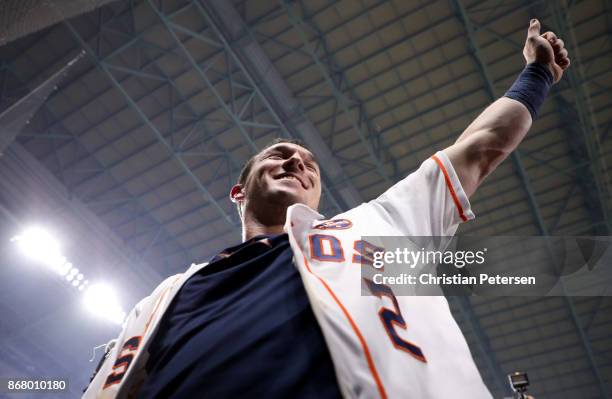 Alex Bregman of the Houston Astros celebrates after hitting the game-winning single during the tenth inning to defeat the Los Angeles Dodgers in game...