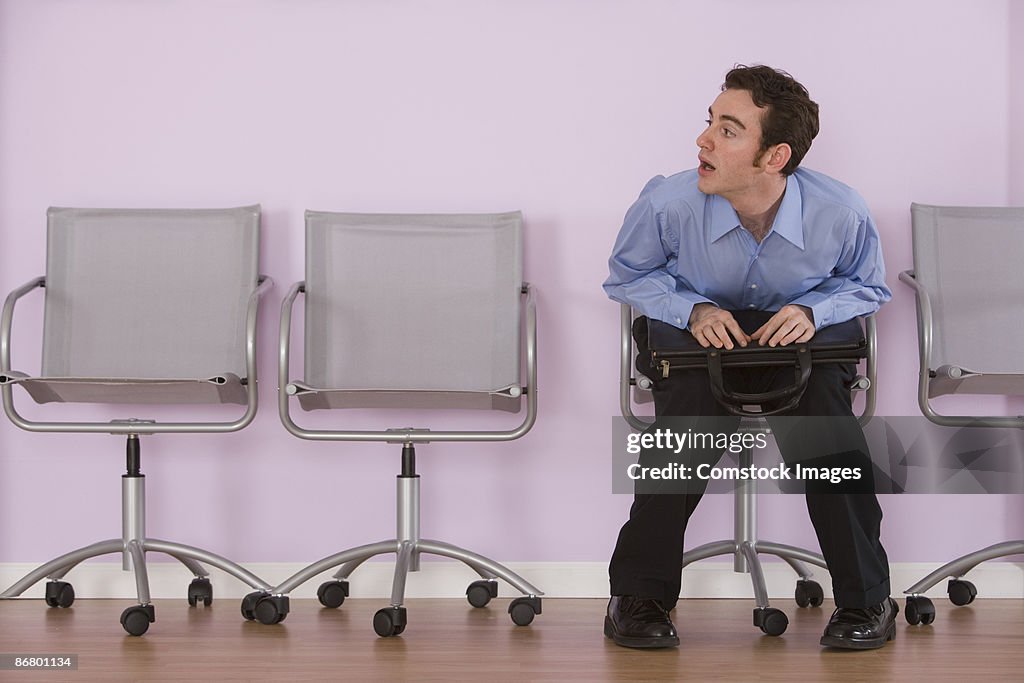 Businessman sitting in waiting room