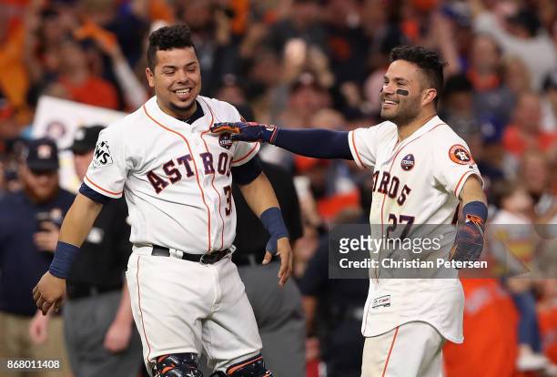 Juan Centeno and Jose Altuve of the Houston Astros celebrate after defeating the Los Angeles Dodgers in game five of the 2017 World Series at Minute...