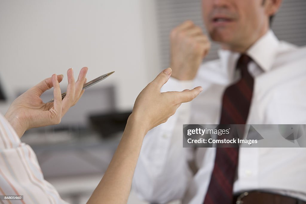 Businessperson gesturing with hands