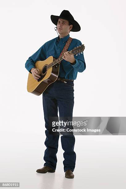 country-western singer with a guitar - country and western fotografías e imágenes de stock