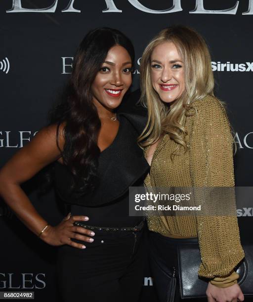 Mickey Guyton and Leah Turner attend SiriusXM presents the Eagles in their first ever concert at the Grand Ole Opry House on October 29, 2017 in...