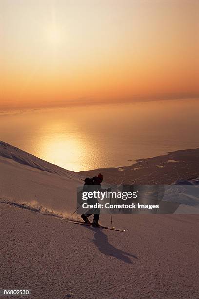 skier skiing down snaefells jokull volcano - olafsvik stock pictures, royalty-free photos & images