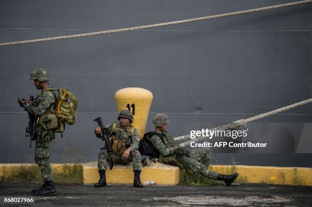 Philippine soldiers arrive at the port of Manila on October 30 with some 500 personnel composed of marines, sailors, aviators and intelligence...
