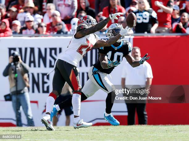 Cornerback Ryan Smith of the Tampa Bay Buccaneers breaks up a pass intended for Wide Receiver Curtis Samuel of the Carolina Panthers during the game...