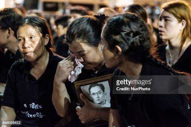 Mourners cry at the final procession to enshrine the relics of the late Thai King Bhumiphol Adulyadej in Bangkok on October 29 2017