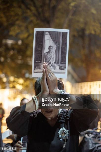 Mourners cry at the final procession to enshrine the relics of the late Thai King Bhumiphol Adulyadej in Bangkok on October 29 2017