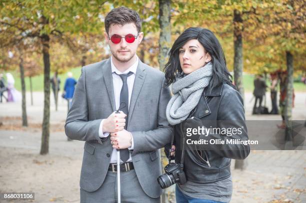Cosplayer in character as Matthew "Matt" Murdock and another as Jessica Jonesfrom Marvels Defenders during day 3 of the MCM London Comic Con 2017...