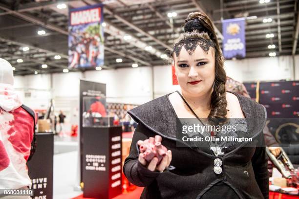 Cosplayer in character as The Evil Queen from Once upon a time episode 7 armoured Unicorn and another as a unicorn version during Day 3 of the MCM...