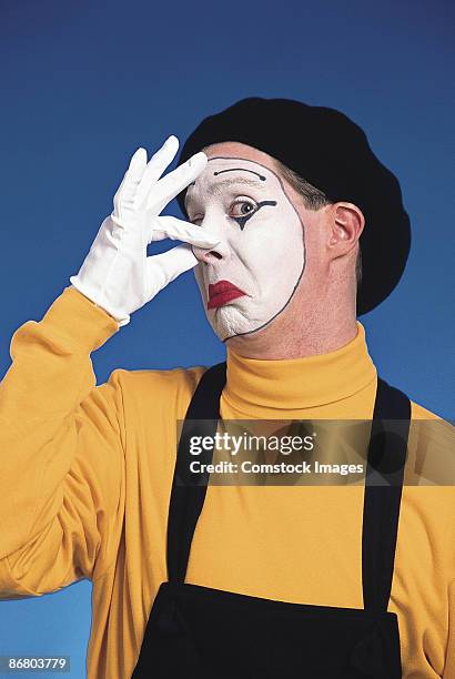 mime holding nose - pinching nose stockfoto's en -beelden