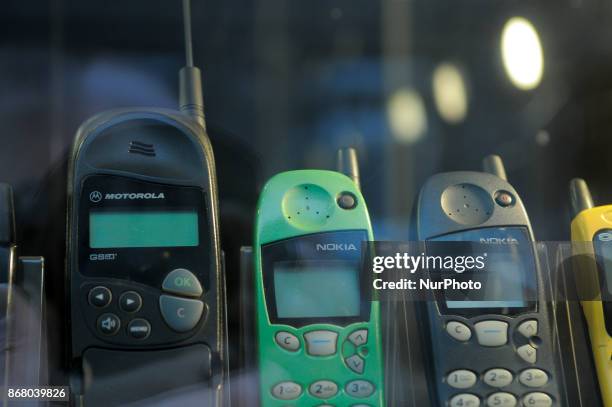 Classic mobile phones are seen in a shop window display in Bydgoszcz, Poland on October 29, 2017.