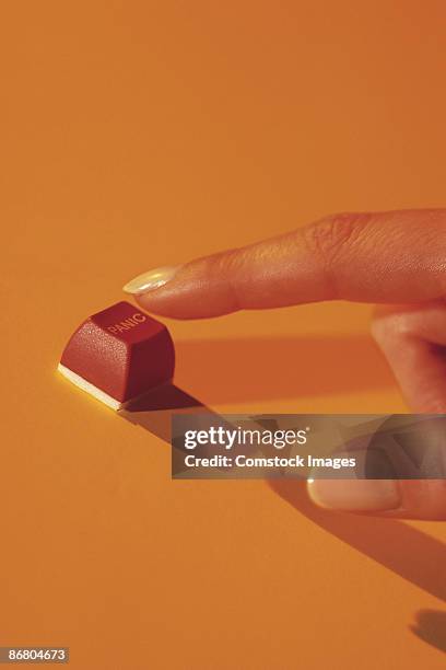 woman pressing panic button - panic button stock pictures, royalty-free photos & images