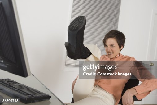 Stressed Woman Kicking Her Computer High-Res Stock Photo - Getty Images