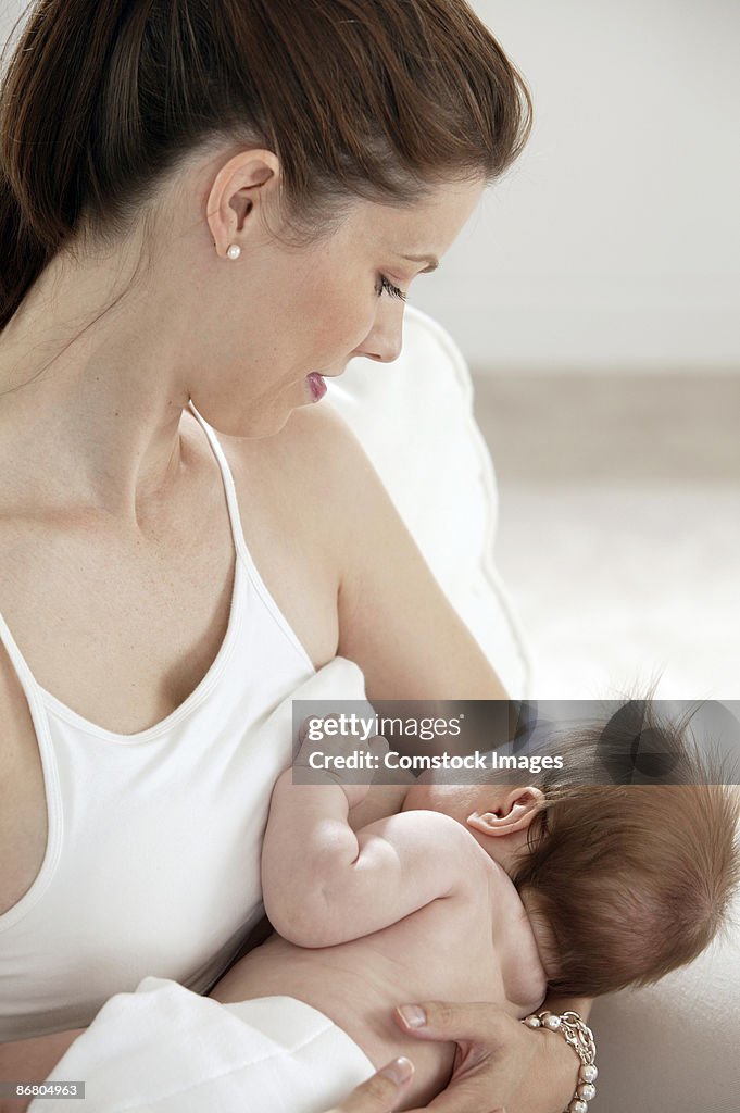 Mother breastfeeding baby