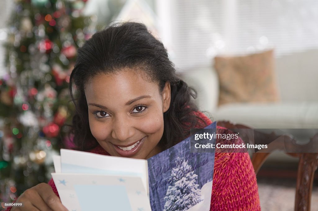 Woman reading Christmas card