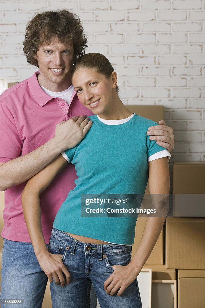 Couple with moving boxes