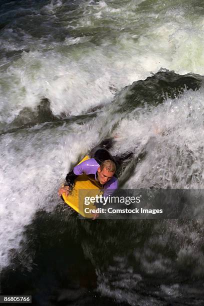 man on body board - isar münchen stock pictures, royalty-free photos & images