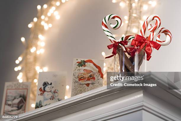 christmas decorations on mantle - mantelpiece stock pictures, royalty-free photos & images