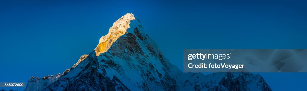 Golden light on snow mountain peak Ama Dablam Himalayas Nepal