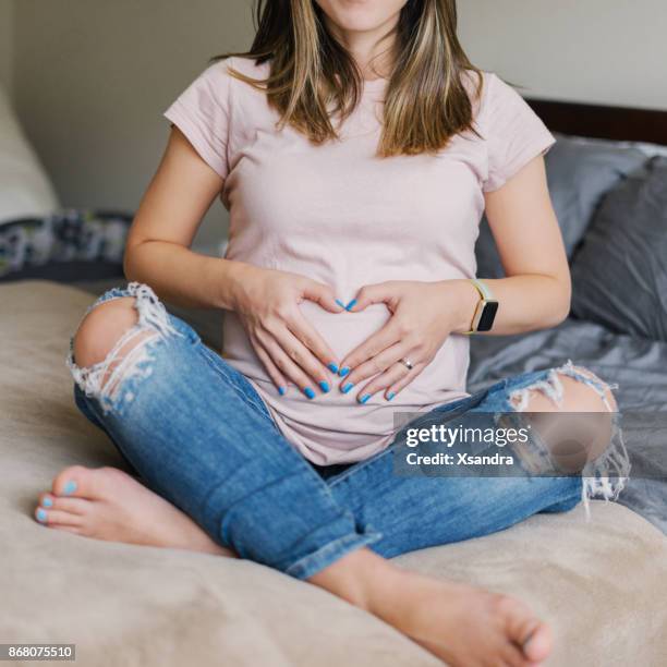 pregnant woman relaxing at home - home manicure stock pictures, royalty-free photos & images