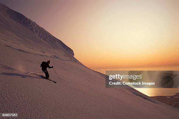 skier skiing down snaefells jokull volcano - olafsvik stock pictures, royalty-free photos & images