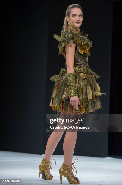 Camille Lou wearing the dress of Nicolas Fafiotte during the 23nd Chocolate Fair 2017 fashion show in Paris.