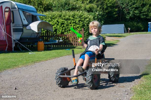 little boy racing on pedal go-karts, denmark - go karts ストックフォトと画像