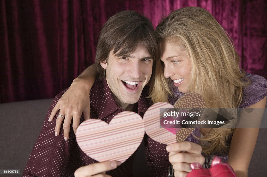 Couple with heart-shaped card