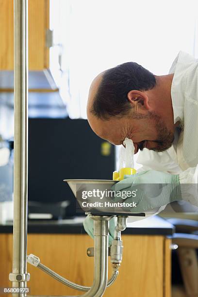 scientist using eyewash - sewer scope stock pictures, royalty-free photos & images
