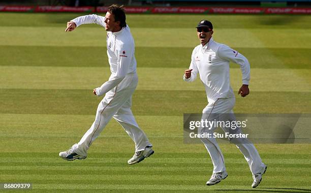 England bowler Graeme Swann celebrates with Kevin Pietersen after taking the wicket of West Indian batsman Sulieman Benn during day three of the 1st...