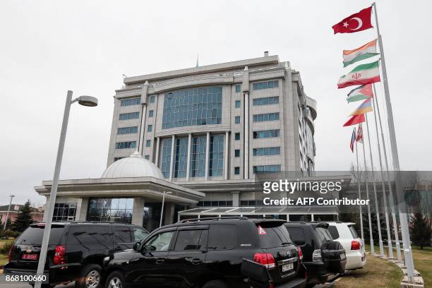 Cars are parked outside Rixos President Hotel, the venue for Syria peace talks, in Astana on October 30, 2017. A fresh round of peace talks seeking...