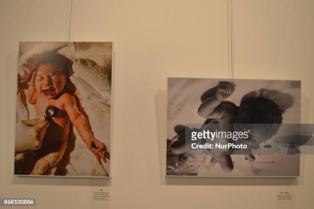 Photographs by Turkish photographer Ipek Ugural are seen on the closing day of the '30 Doradus - Stars on Earth from Birth' Photography Exhibition at...
