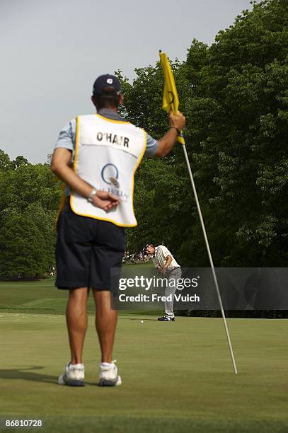 Quail Hollow Championship: Sean O'Hair in action, attempting eagle putt on No 15 as caddie Paul Tesori holds pin flag during Sunday play at Quail...