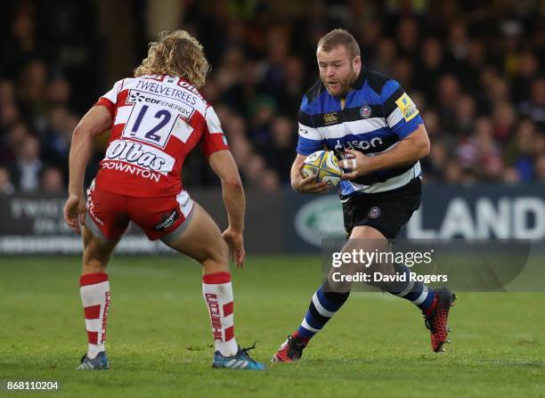 Tom Dunn of Bath takes on Billy Twelvetrees during the Aviva Premiership match between Bath Rugby and Gloucester Rugby at the Recreation Ground on...