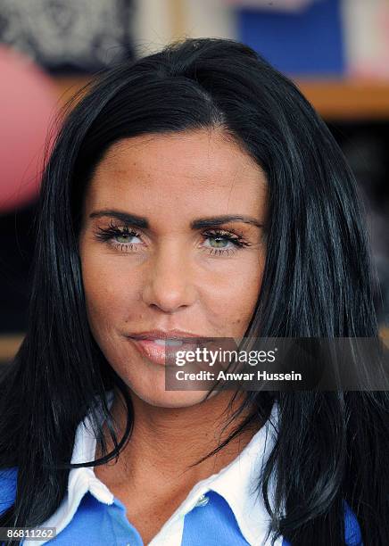 Katie Price, aka Jordan, promotes her branded goods at a tradestand during the Badminton Horse Trials on May 8, 2009 in Acton Turville, England.