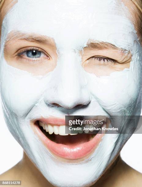 close-up of female with cleansing mask - beauty mask stock pictures, royalty-free photos & images