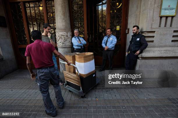 Boxes are carried out of the Department of the Catalan Vice President on October 30, 2017 in Barcelona, Spain. The Spanish government has responded...