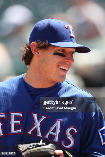 Ian Kinsler of the Texas Rangers gets ready in the dugout before the game against the Oakland Athletics at the Oakland-Alameda County Coliseum in...