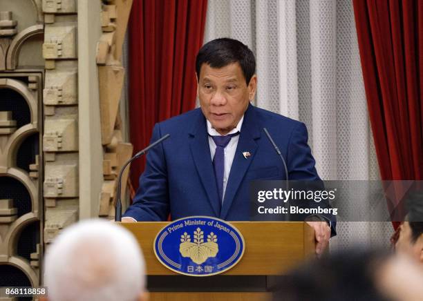 Rodrigo Duterte, the Philippines' president, delivers a speech before a dinner with hosted by Shinzo Abe, Japan's prime minister, and his wife Akie...