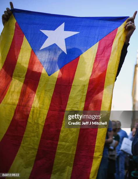 Independence supporters gather outside the Palau Catalan Regional Government Building as Catalonia returns to work following last week's decision by...