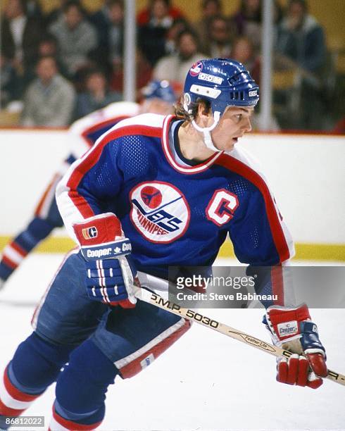 Dale Hawerchuk of the Winnipeg Jets skates against the Boston Bruins at Boston Garden.