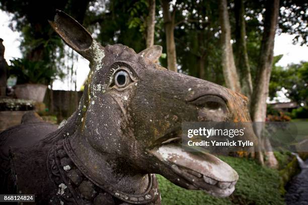 stone sculpture at tirta gangga water palace - bali horse fotografías e imágenes de stock